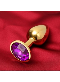 Золотистая анальная пробка с фиолетовым кристаллом - Сима-Ленд - купить с доставкой в Абакане